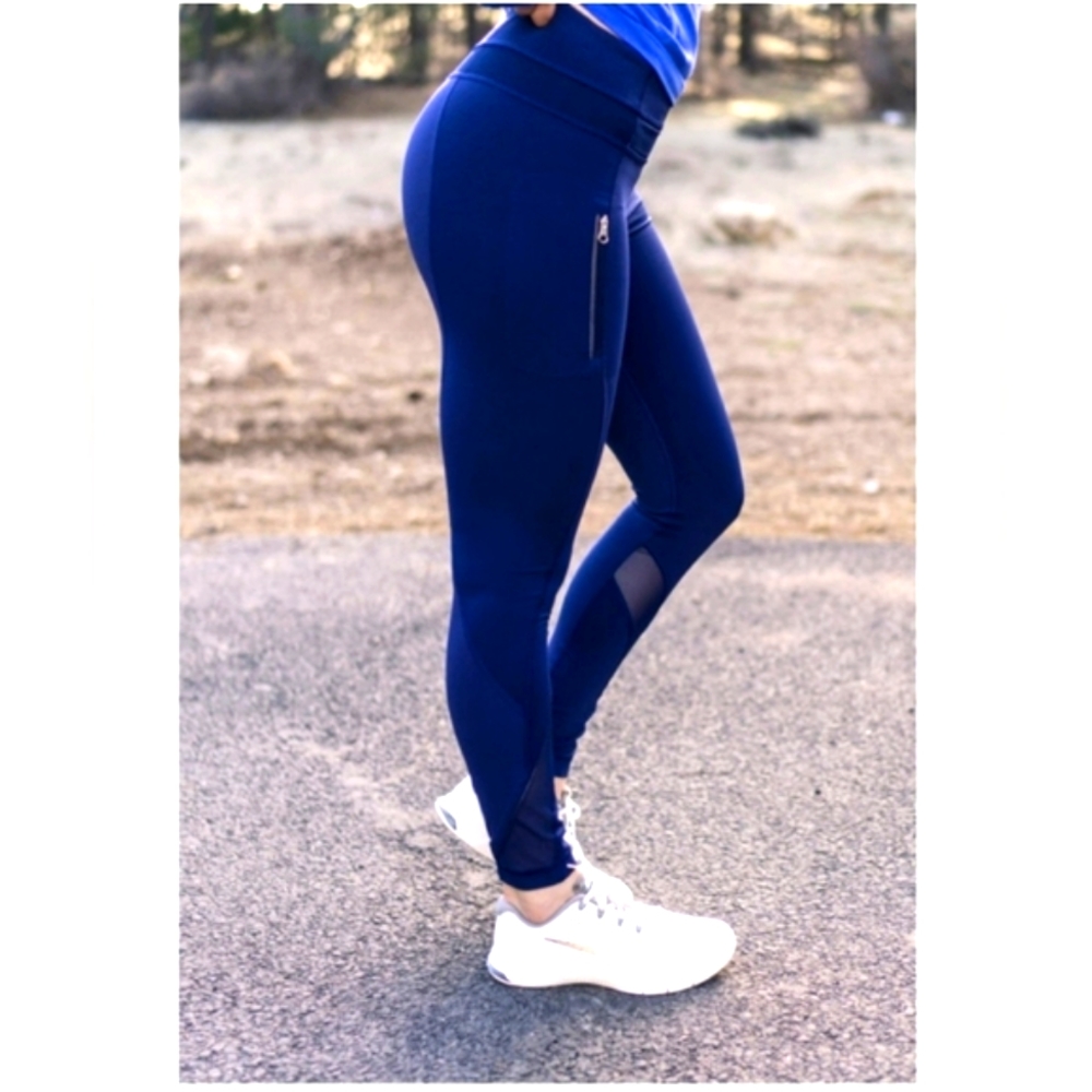 Lululemon Invigorate navy blue leggings w/ mesh detail and zip pockets size 10